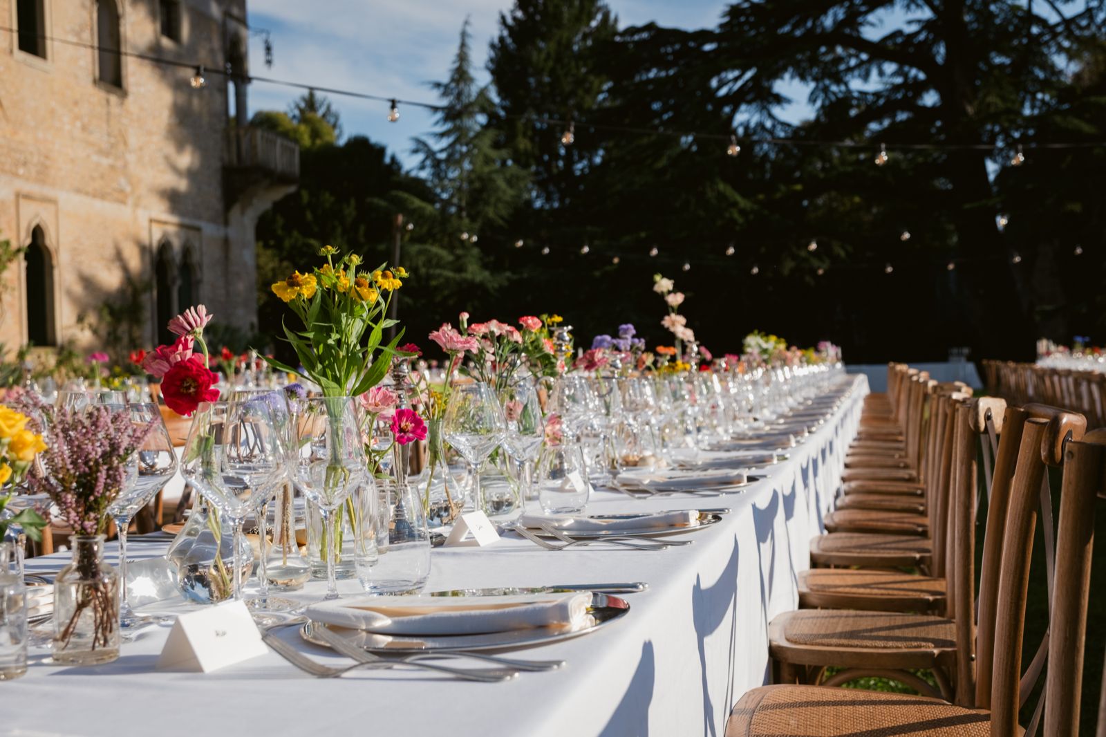 Wild flowers along the laid table, beside the abbey